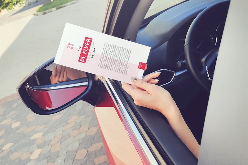 DL Flyer In Hand Mockup-2.jpg